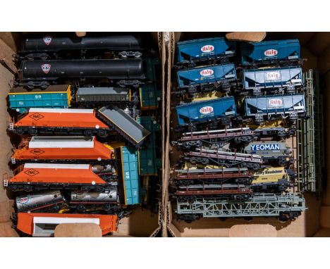 A quantity of OO gauge Freight Rolling Stock. Including Blue Circle Tank Wagons. (some weathered). Milk Tank Wagons. Prestwin