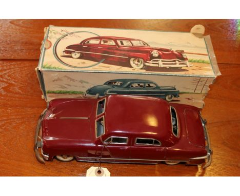 A late 1940's American style tinplate clockwork saloon/ sedan. A German example made by S.G (Gunthermann) in the U.S. Zone Ge