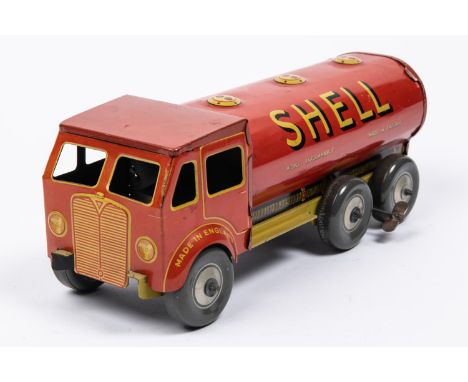 A Mettoy tinplate clockwork Shell BP Petrol Tanker. The cab is in the style of AEC, a 3-axle example in red with yellow chass