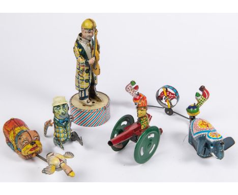 5 Tinplate Toys. Clockwork Clown playing Violin. Friction powered Bulldog chasing Duck, made in Japan. Clockwork Elephant pul