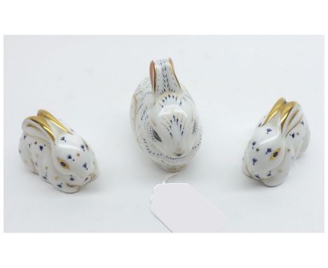 Three Royal Crown Derby Paperweights: Bunny (gold button) and two Baby Rabbits (both with gold buttons), 3" and 2" long respe