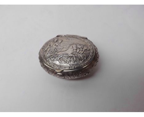 An early 20th Century German Hanau Silver Snuff Box of oval hinged form, the lid decorated with a scene of figures on a horse