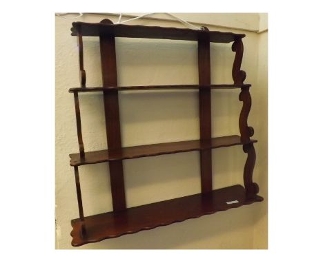 Victorian Mahogany four-tier wall mounted shelf with scrolled side supports, 27" wide  