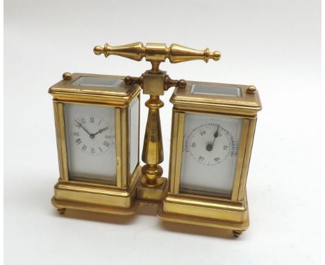 A lacquered Brass Desk Compendium with central T-bar handle inset with a small timepiece opposed by a Barometer with scale of