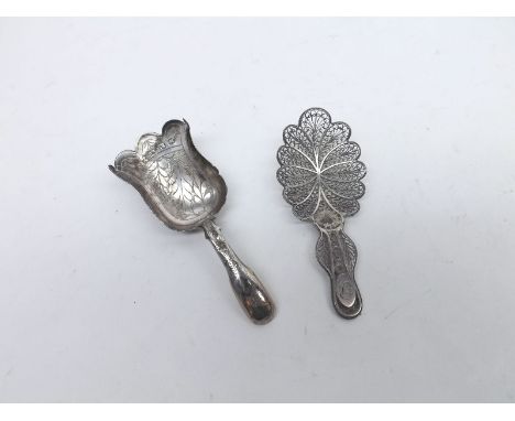 A Mixed Lot comprising: a George III Silver Caddy Spoon, decorated with foliate detail, Birmingham hallmarked, initialled C a