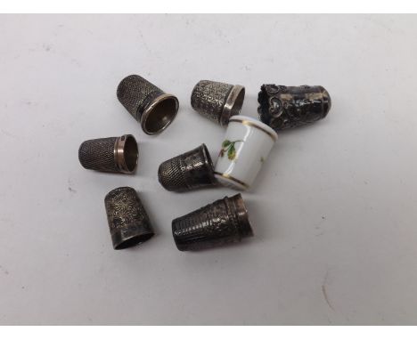 A collection of 19th Century and later Thimbles, of typical design; together with a further Royal Worcester rose decorated Th