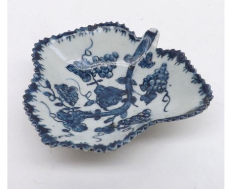 An 18th Century Worcester Pickle Dish of foliate form with twig handle, decorated in underglaze blue with berries and foliage