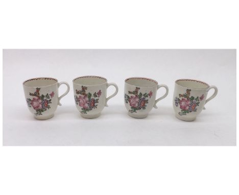 A collection of four Lowestoft Coffee Cups, the bodies polychromed in colours, probably by the Tulip Painter with sprays and 