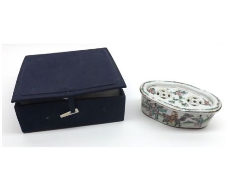 A Chinese small Oval Covered Box, the recessed lid inset with pierced panels and the body decorated with mandarin figures etc