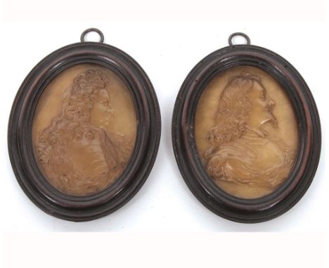 A fine near pair of early 18th Century Pressed Horn Portrait Miniatures by John O'Brisset, one of oval form depicting Charles