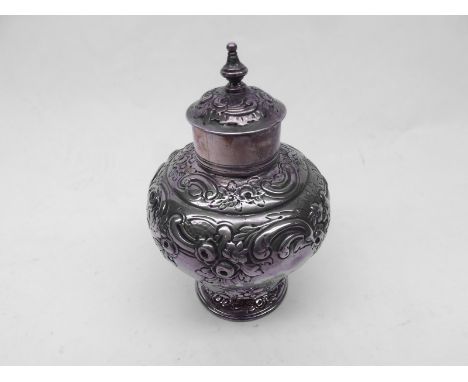 A George I Silver Tea Canister, of round baluster form, the pull-off lid with small finial, the body decorated with stylised 