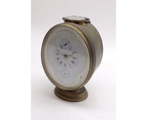 An unusual late 19th Century French lacquered Brass Carriage Alarm Clock, the oval case with carry handle and raised on a fur