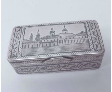 A late 19th Century Russian Silver and Niello work Snuff Box of hinged rectangular form, the lid decorated with panel of vari