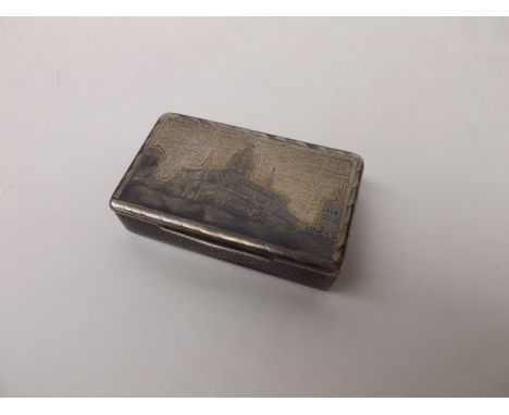 A 19th Century Russian Silver and Niello work Snuff Box of hinged rectangular form, the lid decorated with city scape scene, 