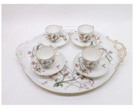 A decorative Limoges Cabaret Set, comprising two handled circular tray and four matching cups and saucers, all decorated in c