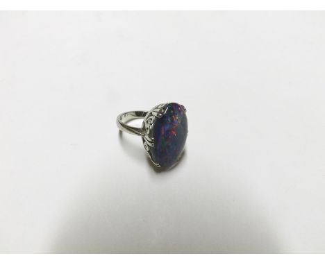 High grade precious metal Opal Doublet Ring, the oval setting pierced with heart designs, stamped "18K"  