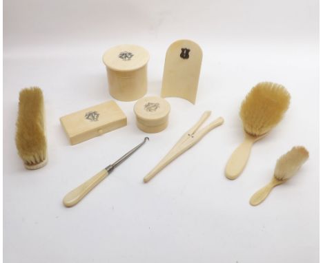 A Victorian eight piece Ivory Backed Dressing Table Set to include brushes, trinket boxes, button hook, glove stretchers etc;