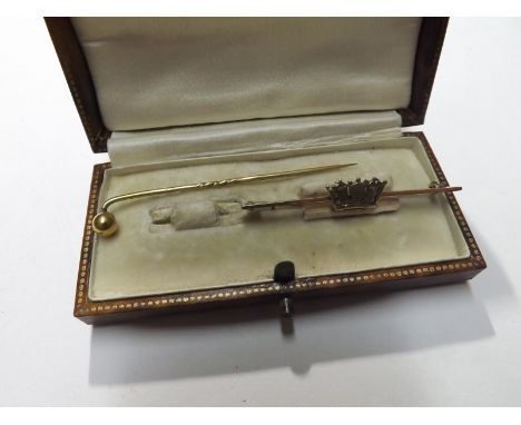 An unmarked yellow metal Bar Brooch with Ducal Crown to the centre, 50mm long; together with a Stick Pin (2)  
