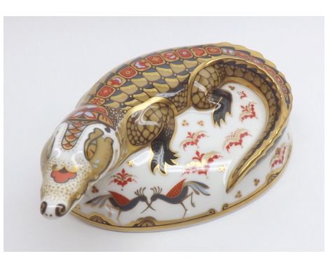 A Royal Crown Derby Paperweight of a Crocodile (gold button), 7" long  