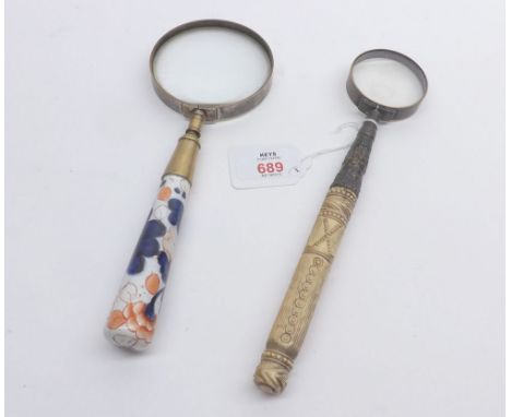 A Mixed Lot comprising: two Vintage Hand-held Magnifier Glasses, one with floral decorated ceramic handle and other with bone