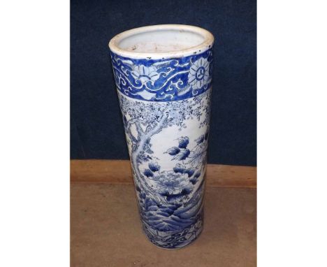 A large Blue Imari Stick Stand of cylindrical form, typically decorated in underglaze blue with flowering foliage, 24 1/2" hi