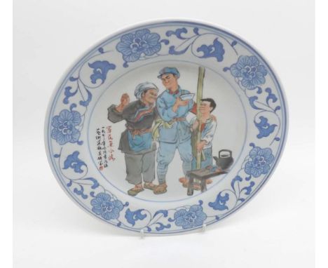 A Chinese Republic Period Circular Plate, the centre painted in colours with scene of solider and workman within a border dec