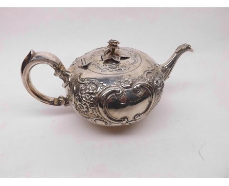 A good quality Victorian Silver Teapot of squat form, the body decorated with rosebud lid finial, the body decorated with sty