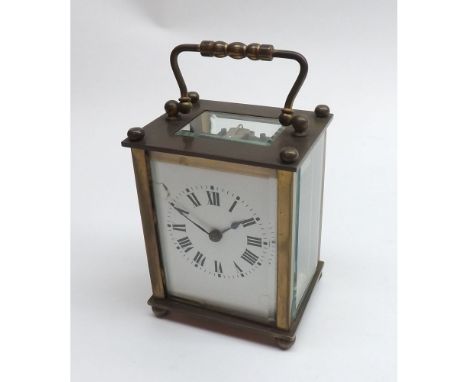 An early 20th Century French Brass Carriage timepiece, the cylinder platform escapement to a Roman enamel dial with outside m
