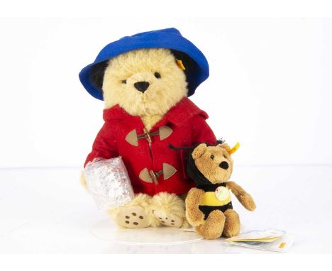 Two Steiff yellow tag teddy bears,  comprising of a Paddington Bear, with golden alpaca fur, carrying a marmalade jar which i