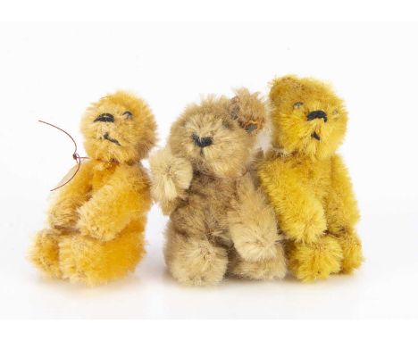 Three post-war Schuco miniature teddy bears, comprising of an apricot mohair bear, light brown mohair bear and a golden mohai