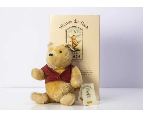 A Steiff limited edition Classic Winnie the Pooh teddy bear, 4939of 10000 for the year 1999, in original box with certificate