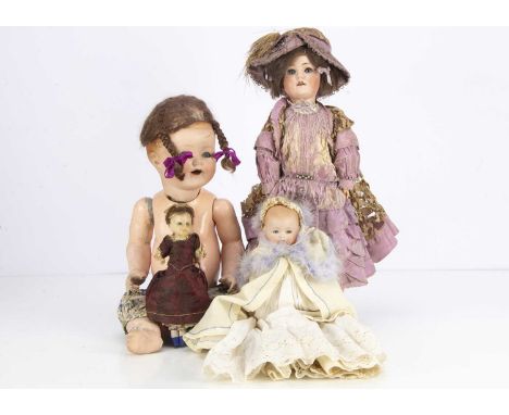 A Max Handwerck 286 Baby Elite,  with lashed blue sleeping eyes, brown mohair wig, jointed composition body, mauve dress and 