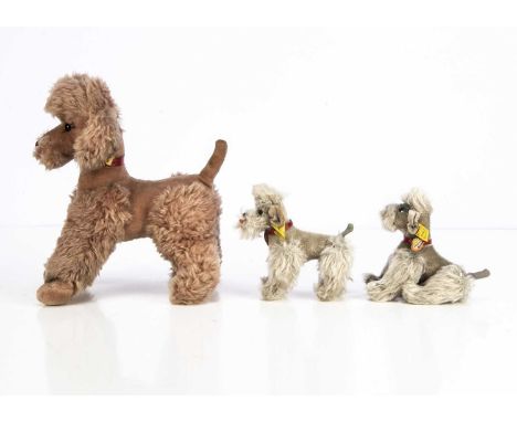 Three post-war Steiff Snobby Poodles, comprising of a light brown draylon Cosy Snobby-- 10 1/2in. (27cm.) high; and two small