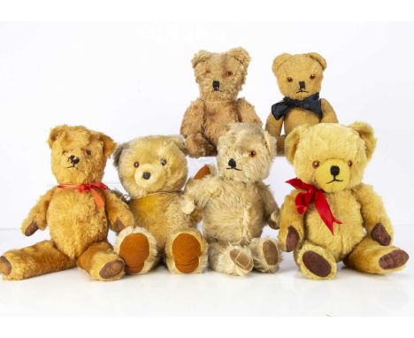 Six post-war British teddy bears, including a possible Pedigree with golden mohair, orange and black plastic eyes, chimes in 