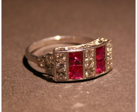 An 18ct. White Gold Art Deco Style Diamond and Ruby Ring, set with bands of diamonds and rubies within a pierced setting, app