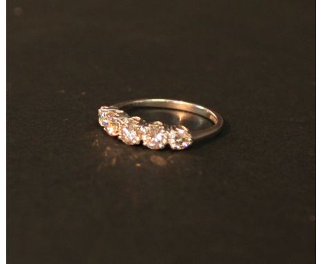 An 18ct. White Gold Five Stone Diamond Ring, with five graduated stones within a pierced setting, approximately 1.21 ct.