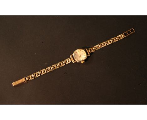 A Tissot 9ct. Gold Cased Ladies' Wrist Watch with 9ct. gold strap, 11.9 gms all in