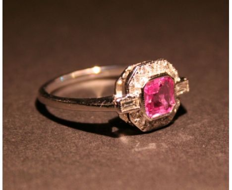 An 18ct. White Gold Pink Sapphire and Diamond Cluster Ring, with a central square pink sapphire surrounded by diamonds and wi