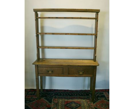 A George III Pine Dresser, the shelf back above two drawers with brass swan neck handles, raised upon square legs, 128 cms wi