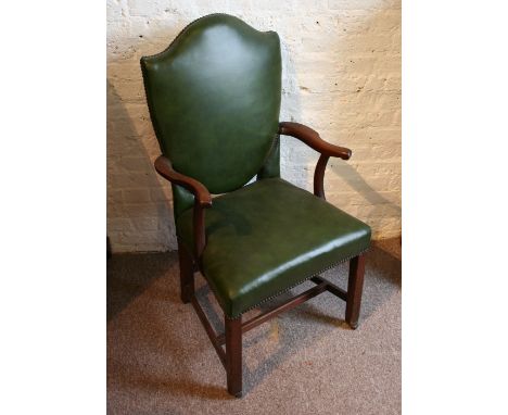 A 19th Century Mahogany Office Armchair, a leather upholstered shield back above a similar seat with brass buttons raised upo