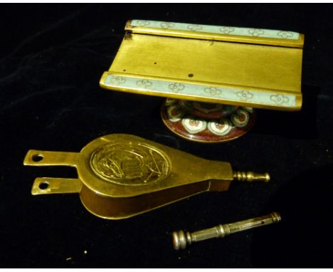 An Enamel Decorated Place Setting, together with a pill box in the form of a pair of bellows and a silver pen