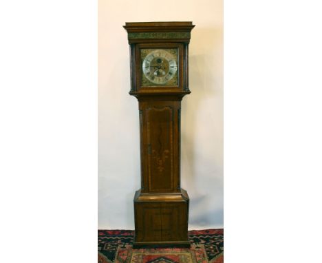 A George III Oak and Marquetry Inlaid Longcase Clock, the square painted hood with turned pilasters above a shaped door and c