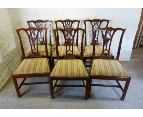 A Set of Six Early 19th Century Mahogany Chippendale Style Dining Chairs, each with a carved pierced back above a drop-in sea