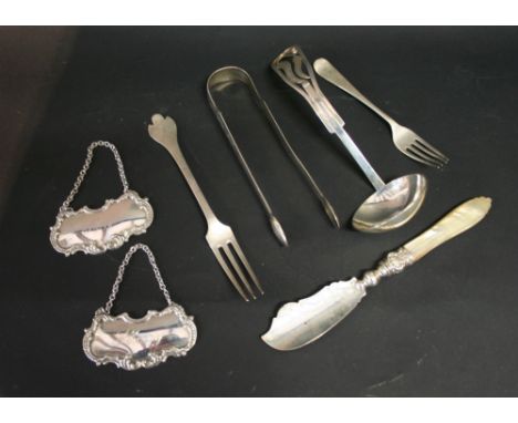 A Sterling Silver Ladle, together with a pair of silver sugar tongs, two silver forks, a silver mother of pearl handled knife