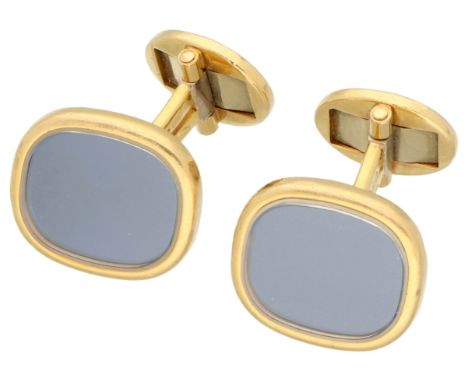 Patek Philippe 18K yellow gold cufflinks Has a blue metallic detail behind glass. In worn condition, signs of use on cuff lin
