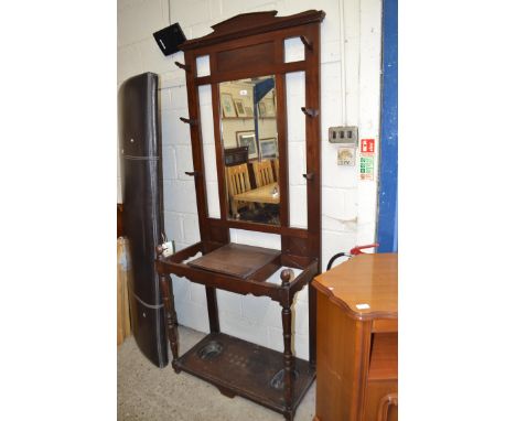 LATE 19TH/EARLY 20TH CENTURY MAHOGANY HALL STAND WITH CENTRAL BEVELLED MIRROR, SUPPORTED ON TURNED FRONT LEGS AND FITTED WITH