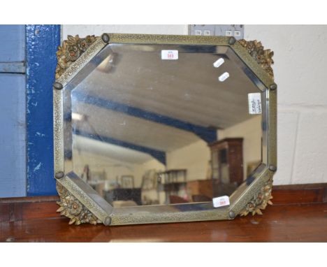 OCTAGONAL WALL MIRROR WITH PRESSED DECORATION METAL SURROUND, APPROX 55 X 45CM