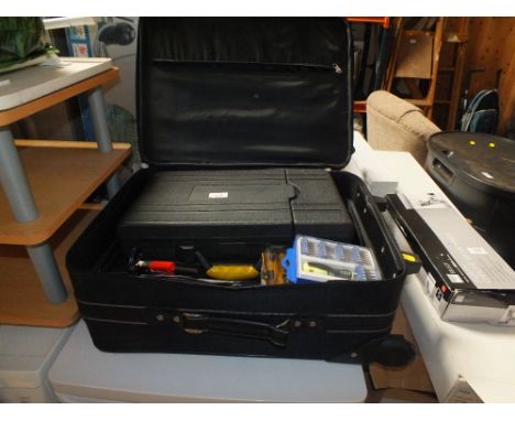 A SUITCASE OF CASED TOOLS AND DRILL BITS