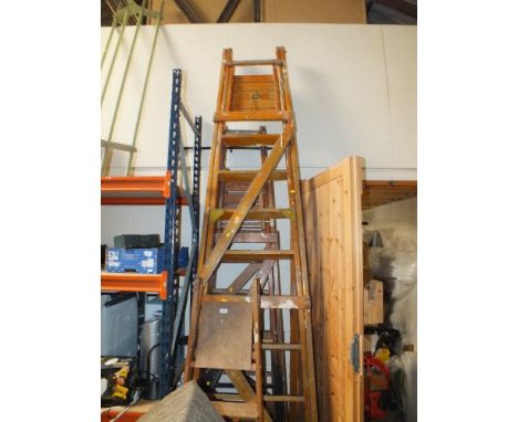 FOUR WOODEN SETS OF STEP LADDERS OF VARIOUS SIZES