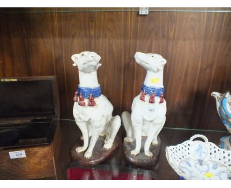 A PAIR OF LARGE CERAMIC STAFFORDSHIRE STYLE DOGS 